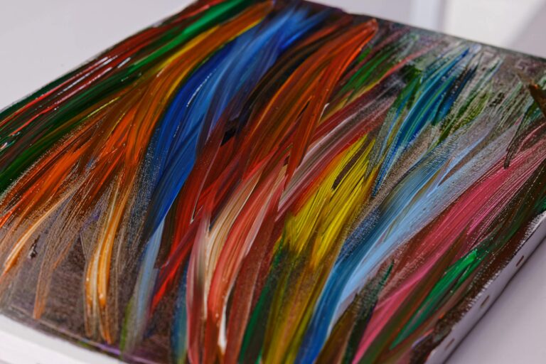 A colorful abstract painting with vibrant brushstrokes on a canvas surface.